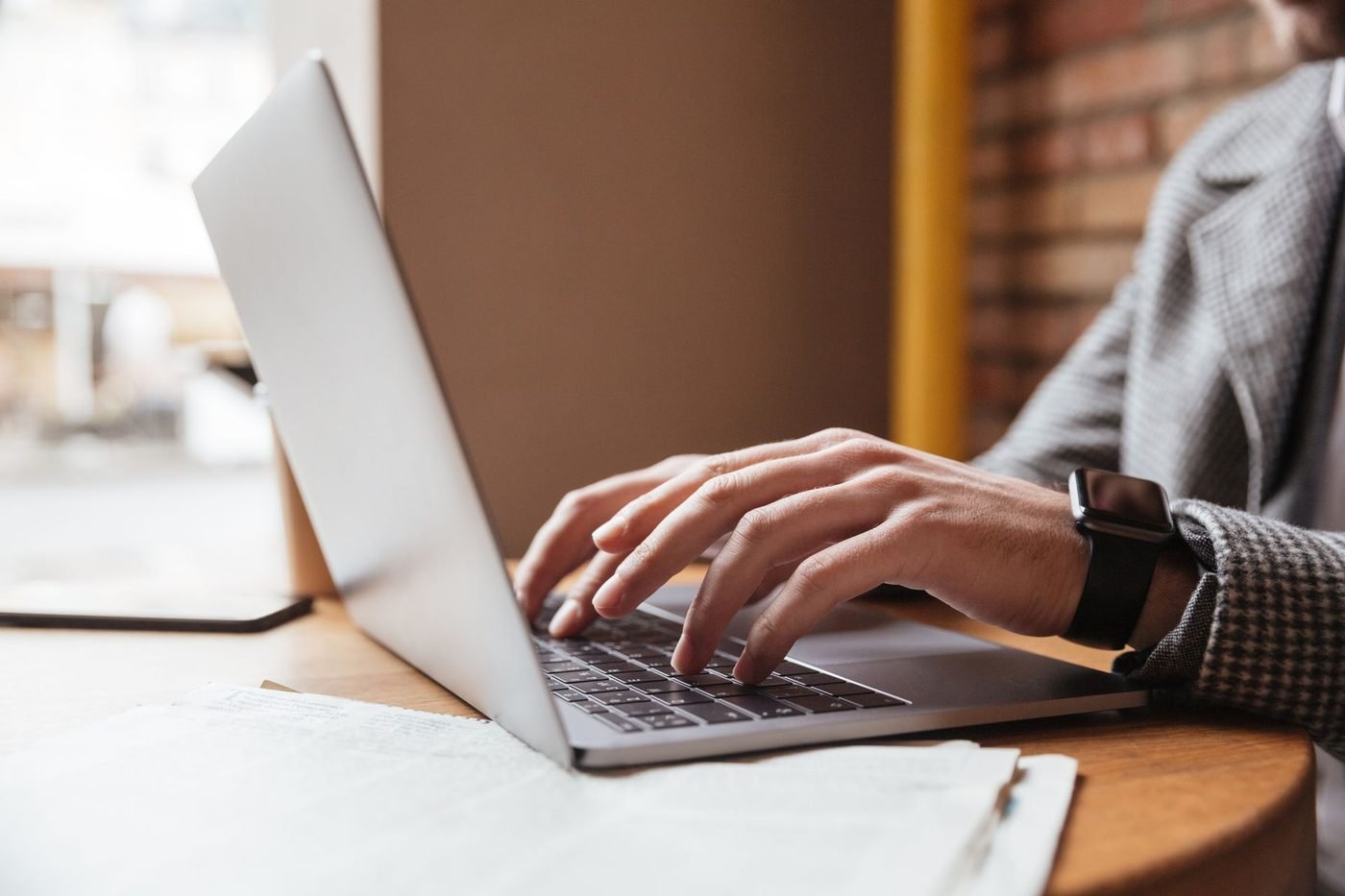 A small-business owner working on a laptop